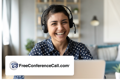 Woman smiling while on a virtual meeting with FreeConferenceCall logo